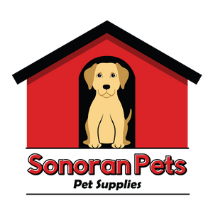 Golden Retriever sitting in the doorway of a red dog house with a black roof. Sonoran Pets Pet Supplies
